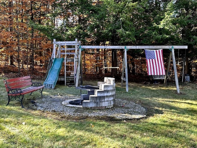 view of playground with a lawn