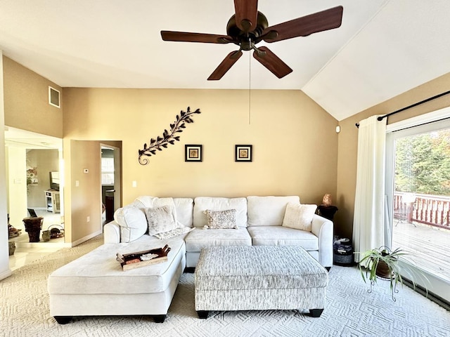 carpeted living area featuring ceiling fan, visible vents, vaulted ceiling, and baseboards