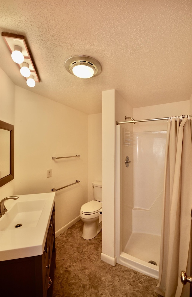 full bath featuring toilet, vanity, a textured ceiling, and a shower with shower curtain