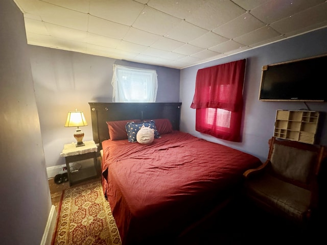 bedroom featuring baseboards