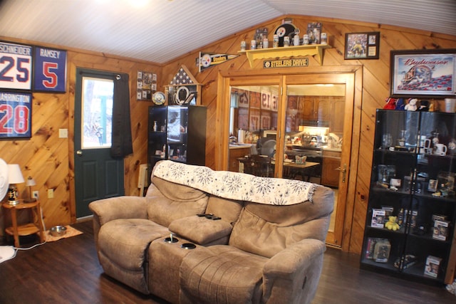 living area with wooden walls, vaulted ceiling, and dark wood finished floors