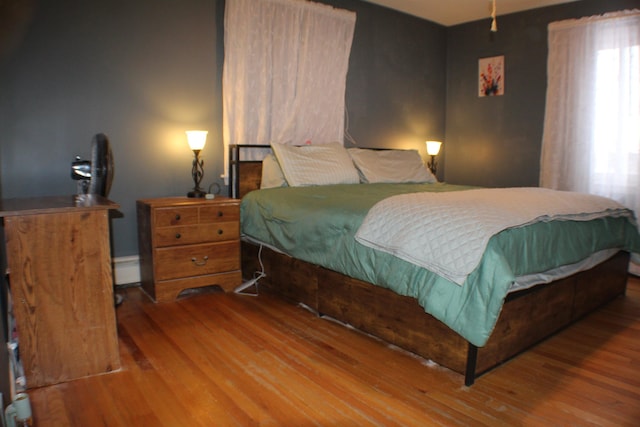 bedroom with wood finished floors