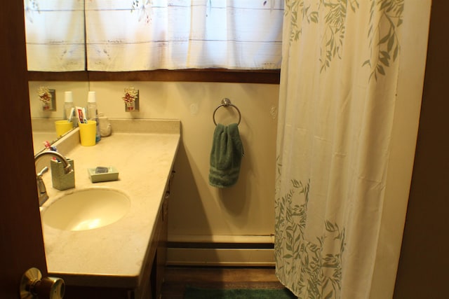 full bathroom with a shower with shower curtain and vanity