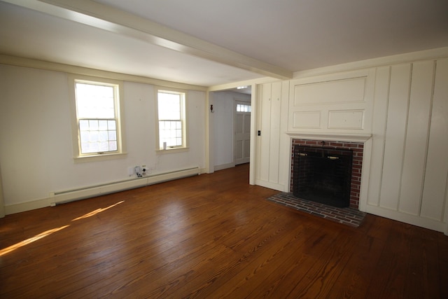 unfurnished living room featuring dark wood-type flooring, a baseboard radiator, and a fireplace