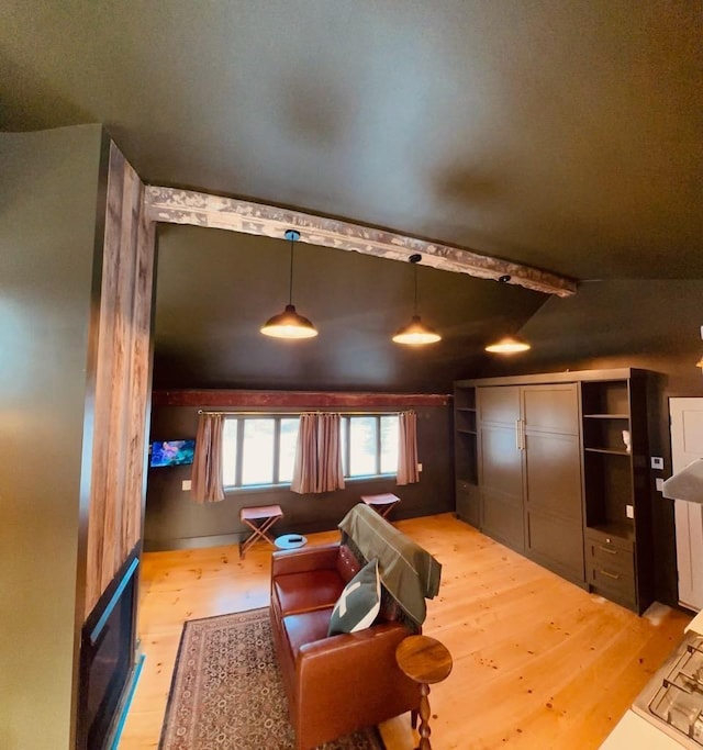 interior space featuring lofted ceiling and light wood finished floors