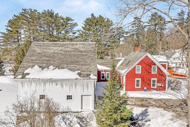 view of front of house featuring a chimney