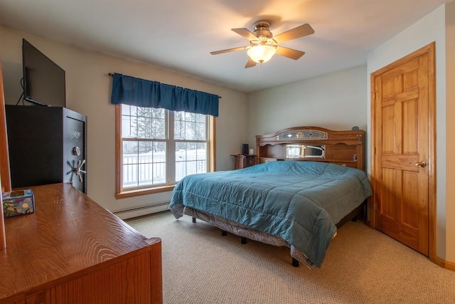 bedroom featuring a baseboard heating unit, light carpet, and ceiling fan