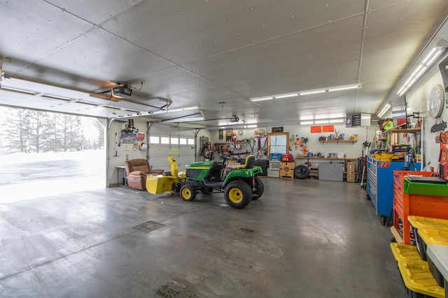 garage featuring a workshop area and a garage door opener