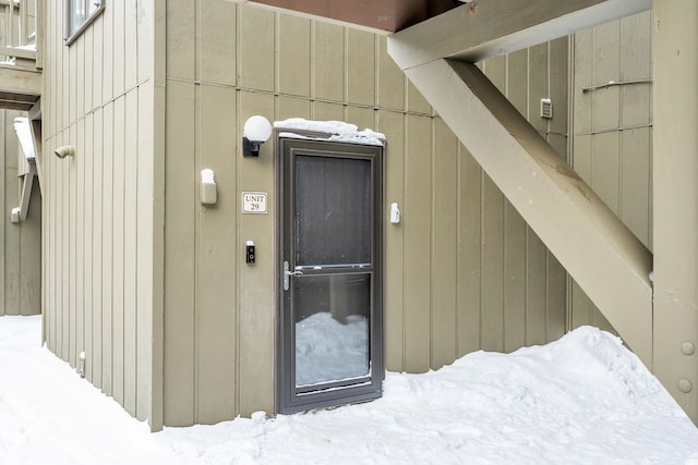 view of snow covered property entrance