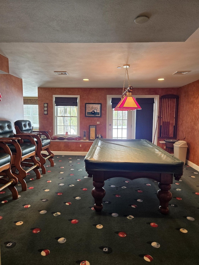 game room featuring carpet floors, baseboards, visible vents, and a wealth of natural light