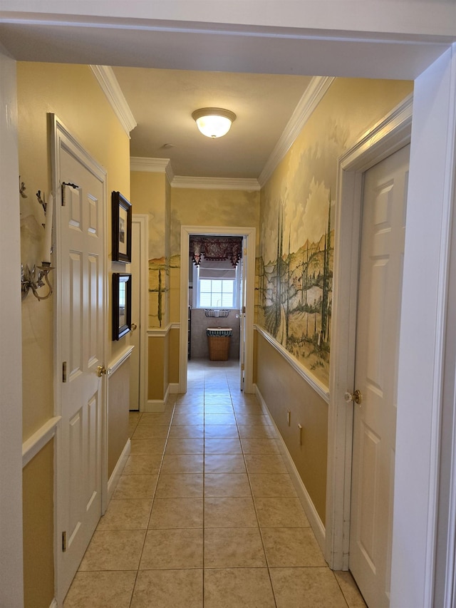 hall featuring ornamental molding, light tile patterned flooring, and baseboards