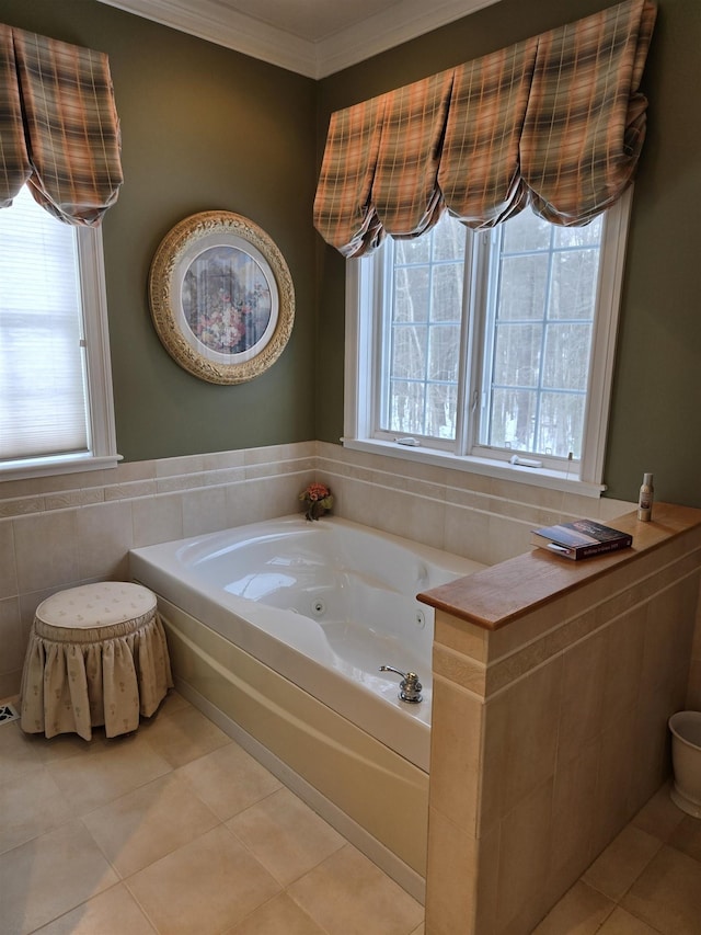 full bathroom featuring ornamental molding, tile walls, a jetted tub, and tile patterned floors