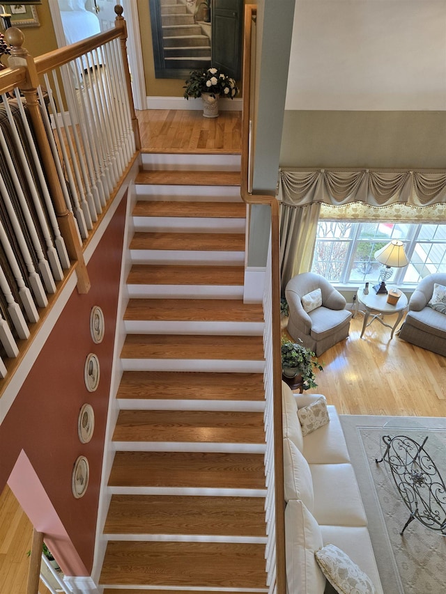 stairway featuring wood finished floors