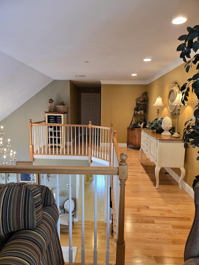 staircase featuring recessed lighting, visible vents, baseboards, and wood finished floors