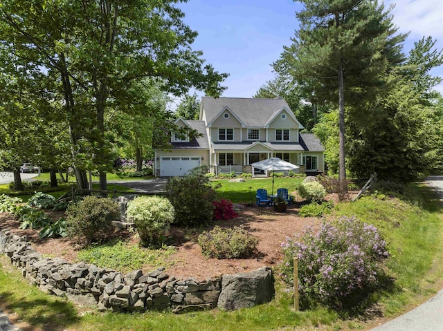 exterior space featuring a front lawn and an attached garage