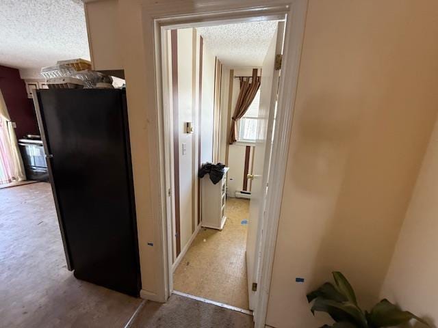 corridor with a textured ceiling