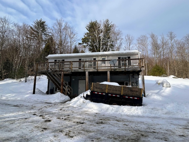 view of front of house with a deck and stairs