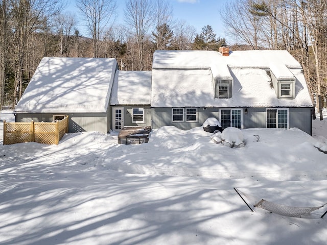 view of front of home featuring a chimney