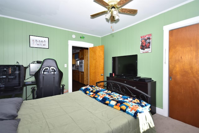 bedroom featuring carpet, ceiling fan, and crown molding