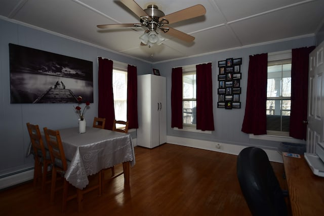 dining room with ceiling fan, crown molding, and wood finished floors