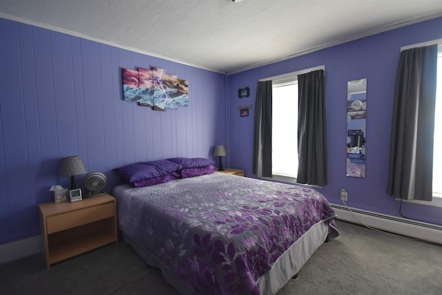 bedroom with a baseboard heating unit and carpet floors