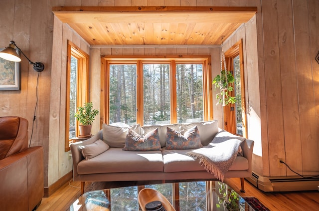 sunroom / solarium with wood ceiling and baseboard heating