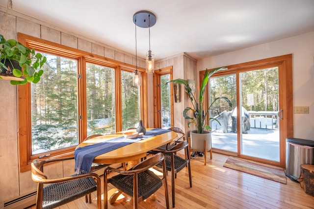 dining space with light wood-style flooring