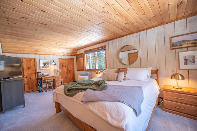 carpeted bedroom featuring wooden ceiling and wooden walls