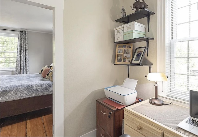 bedroom with wood finished floors