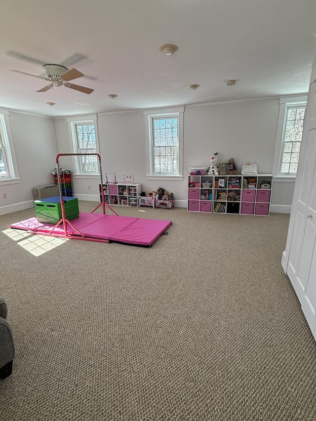 playroom with carpet flooring and baseboards