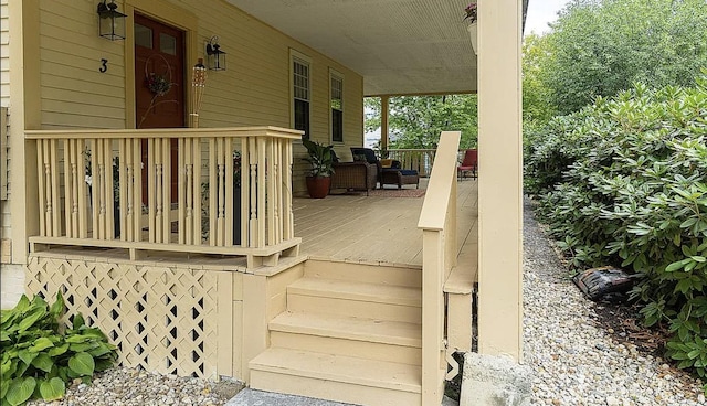 wooden deck featuring covered porch