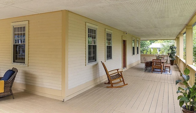 deck featuring outdoor dining area