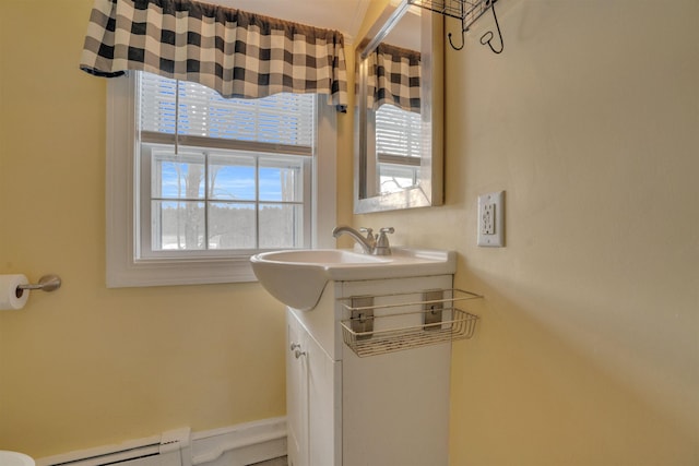 bathroom featuring a baseboard radiator and vanity