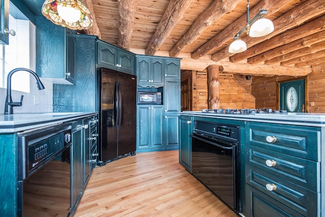 kitchen featuring light wood-style flooring, wooden ceiling, blue cabinetry, and black appliances