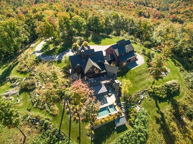 drone / aerial view with a view of trees