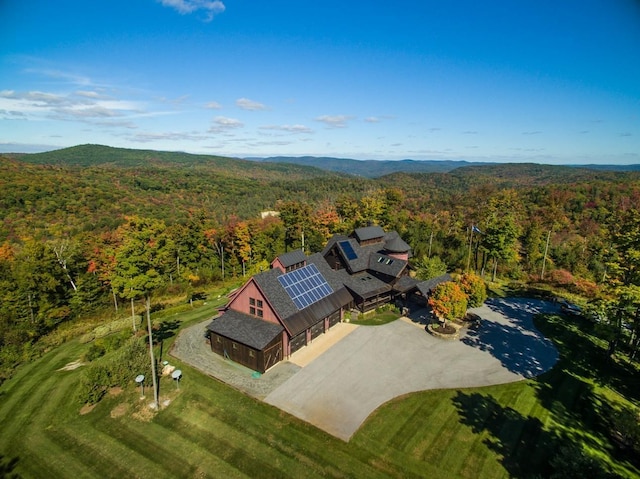 drone / aerial view featuring a view of trees