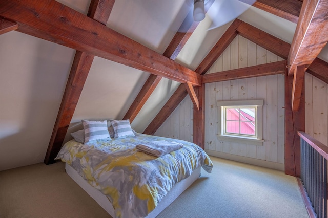 bedroom featuring lofted ceiling with beams, carpet flooring, and wooden walls