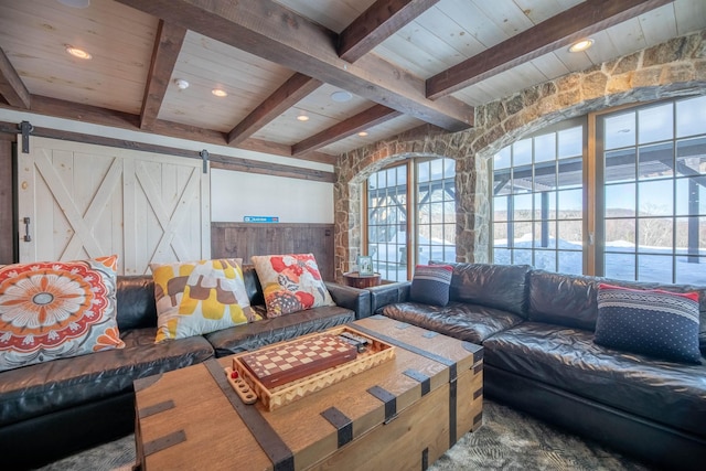 living room with a wainscoted wall, recessed lighting, a barn door, wooden ceiling, and beamed ceiling