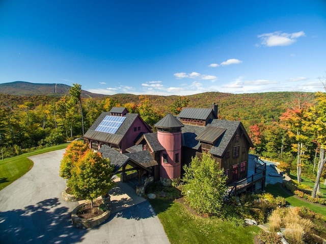 aerial view featuring a mountain view and a wooded view