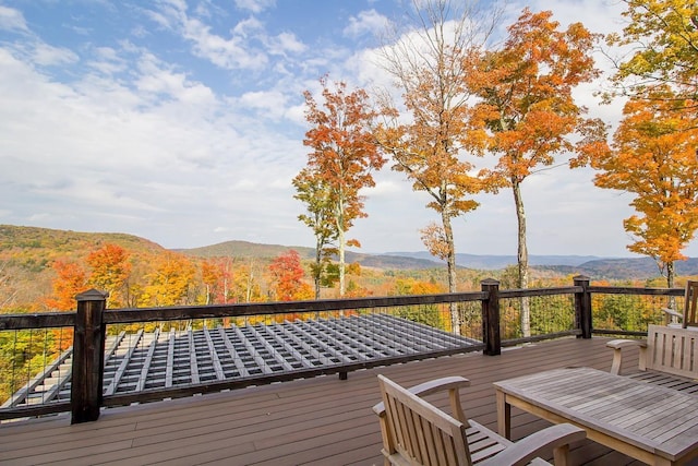 wooden deck featuring a mountain view