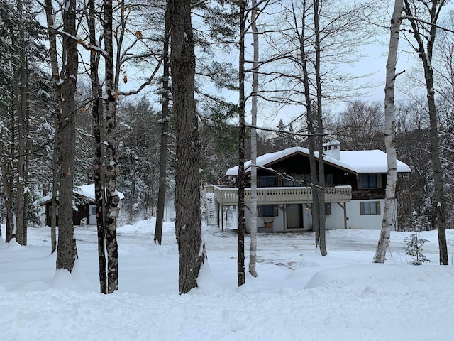 chalet / cabin featuring a garage and a deck