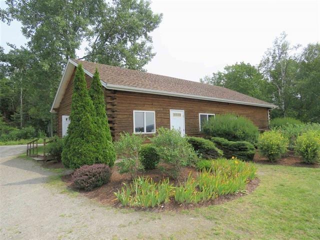 view of side of home with log exterior