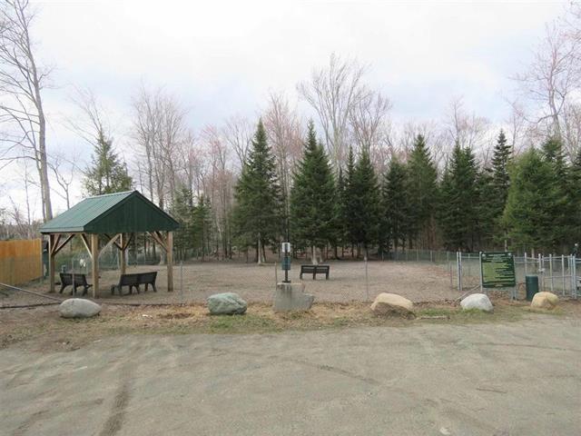 view of property's community featuring fence and a gazebo