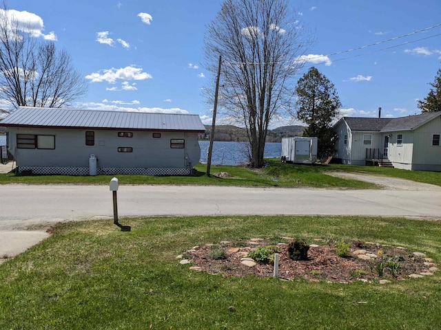 view of yard with a water view