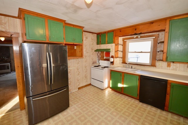 kitchen featuring white electric stove, a sink, green cabinets, black dishwasher, and freestanding refrigerator