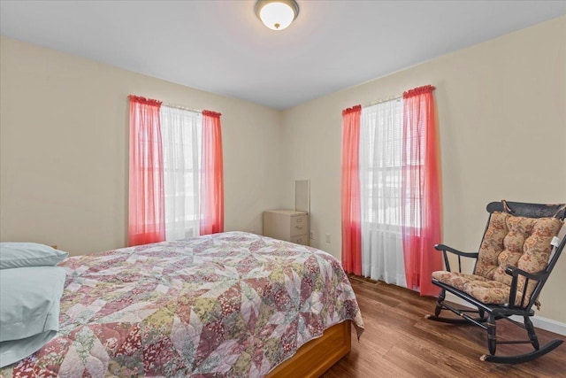 bedroom featuring wood finished floors