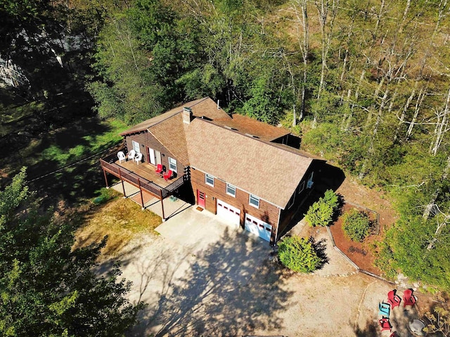 drone / aerial view featuring a view of trees