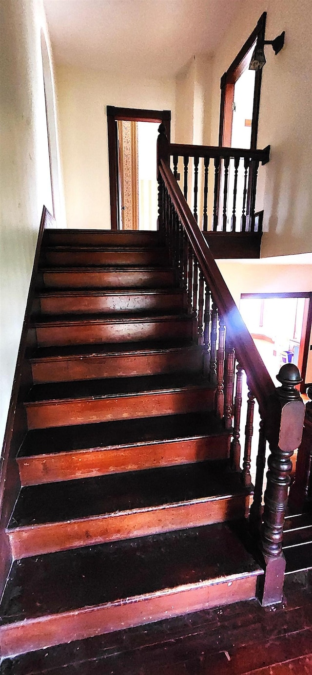 staircase featuring a wealth of natural light