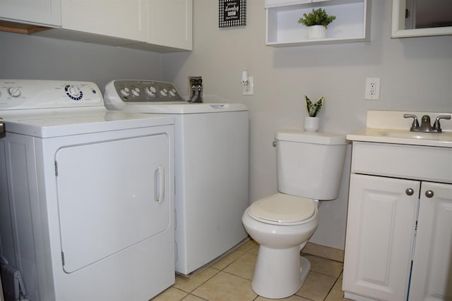 bathroom with tile patterned floors, vanity, toilet, and separate washer and dryer