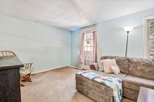 living room with carpet flooring and baseboards